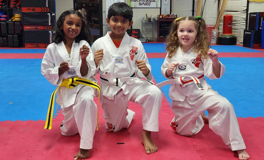 three-young-taekwondo-students-posing-in-dobok